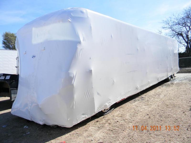 Comercial Bus wreck wrapped to mitigate damage and preserve evidence